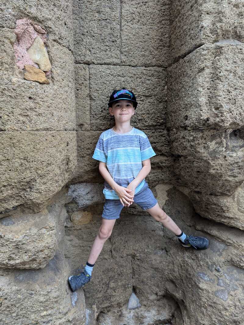 Miles climbing the theatre wall