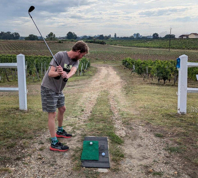 Stu hitting a golf ball